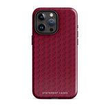 A protective iPhone case with a maroon background and a repeating pattern of small eyeglasses. Designed for the iPhone 15 Pro Max, the camera and buttons of the phone are visible. The bottom of the case features the text "Rockstar Red for iPhone" in white from Statement Cases.