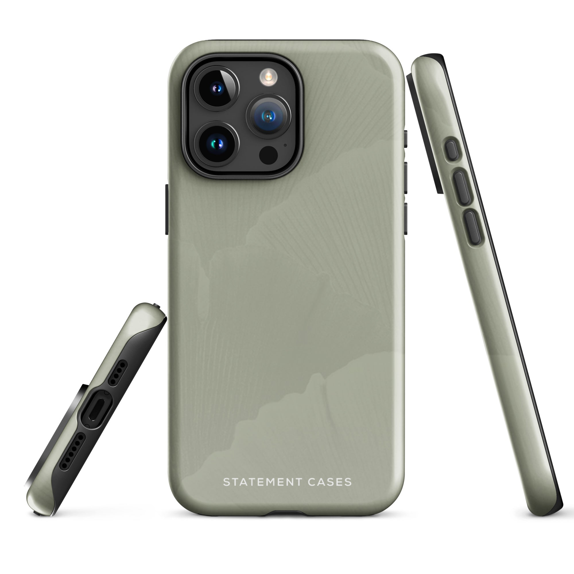A sleek pale green Pistachio Haze for iPhone case with a subtle floral pattern on the back. Designed for the iPhone 15 Pro Max, it has precise cutouts for the camera lenses and features the brand name "Statement Cases" in white text at the bottom.