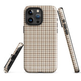 A smartphone with a brown and beige houndstooth-patterned case is shown from the back. The impact-resistant, dual-layered Classic Houndstooth for iPhone by Statement Cases protects the phone's body and leaves openings for the camera lenses and flash. The hues give the case a stylish and sophisticated appearance.