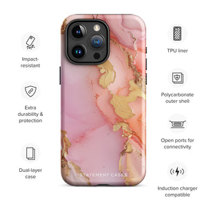 The Gold Blush Marble for iPhone showcases a glossy, marble-patterned case in shades of pink and gold. The decorative design features swirling patterns, seamlessly blending the colors. Crafted with impact-resistant polycarbonate for superior phone protection, "Statement Cases" is written in white at the bottom.