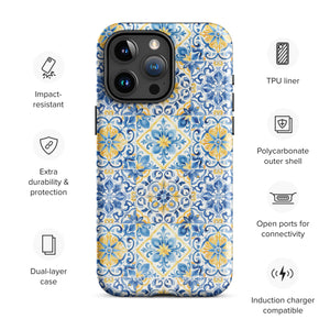 The Blue Mirage for iPhone by Statement Cases features a dual-layered, impact-resistant polycarbonate exterior with a TPU inner liner. Inspired by traditional Portuguese tiles, the blue and yellow patterned case boasts an intricate design of floral and geometric motifs. With its elegant and colorful appearance, the phone's camera is visible at the top left of the case.