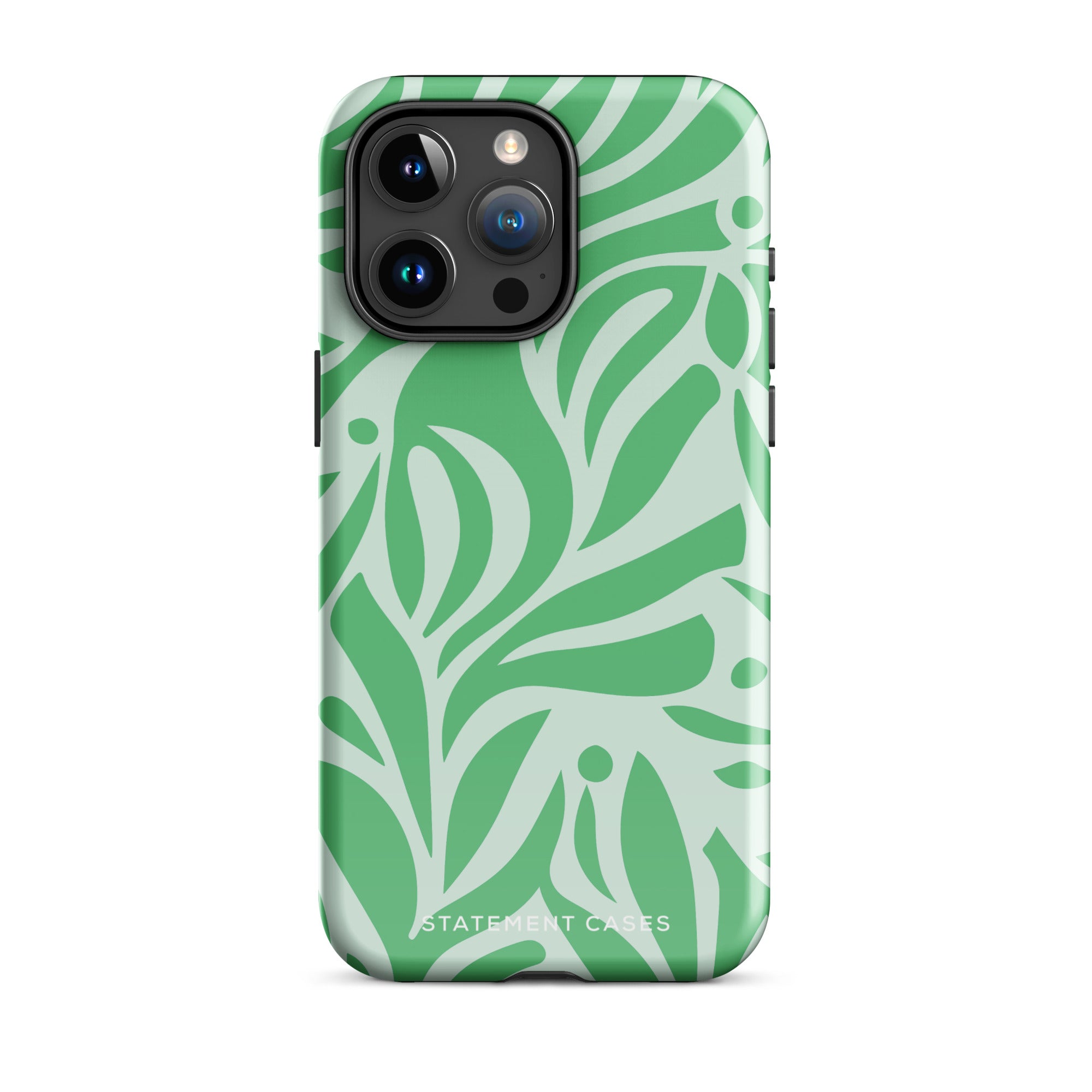 The Selva Verde for iPhone by Statement Cases is shown from the back, featuring a green and light green leaf-patterned protective case. The case highlights the smartphone's camera module with multiple lenses. Designed with impact-resistant polycarbonate, it has a smooth finish and "Statement Cases" printed near the bottom.