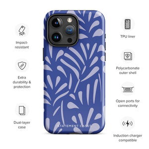 An iPhone encased in the "Mariposa Azul" by Statement Cases, featuring a blue design with an abstract white leaf pattern. The case combines curved and pointed shapes and provides dual-layer protection with TPU lining and impact-resistant polycarbonate. Camera lenses and other top elements remain unobstructed, and "Statement Cases" is inscribed at the bottom.