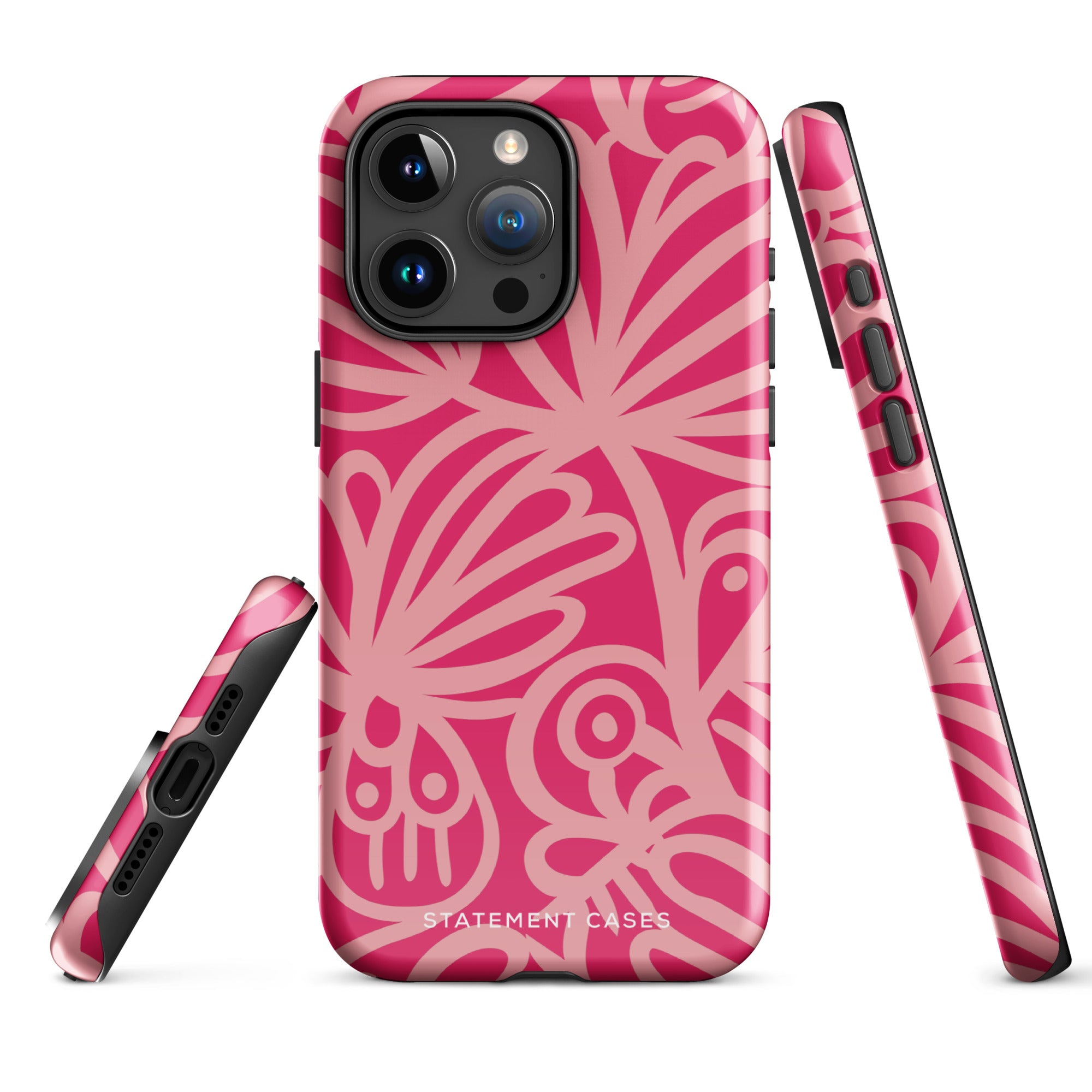 Introducing the Zafiro Rosa for iPhone by Statement Cases: a smartphone case featuring abstract floral and leaf patterns in various shades of pink. This dual-layer protection case combines an impact-resistant polycarbonate exterior with a TPU inner liner to ensure durability. The design showcases the brand name "Statement Cases" at the bottom, with precise cutouts revealing the phone’s camera lenses at the top left corner.