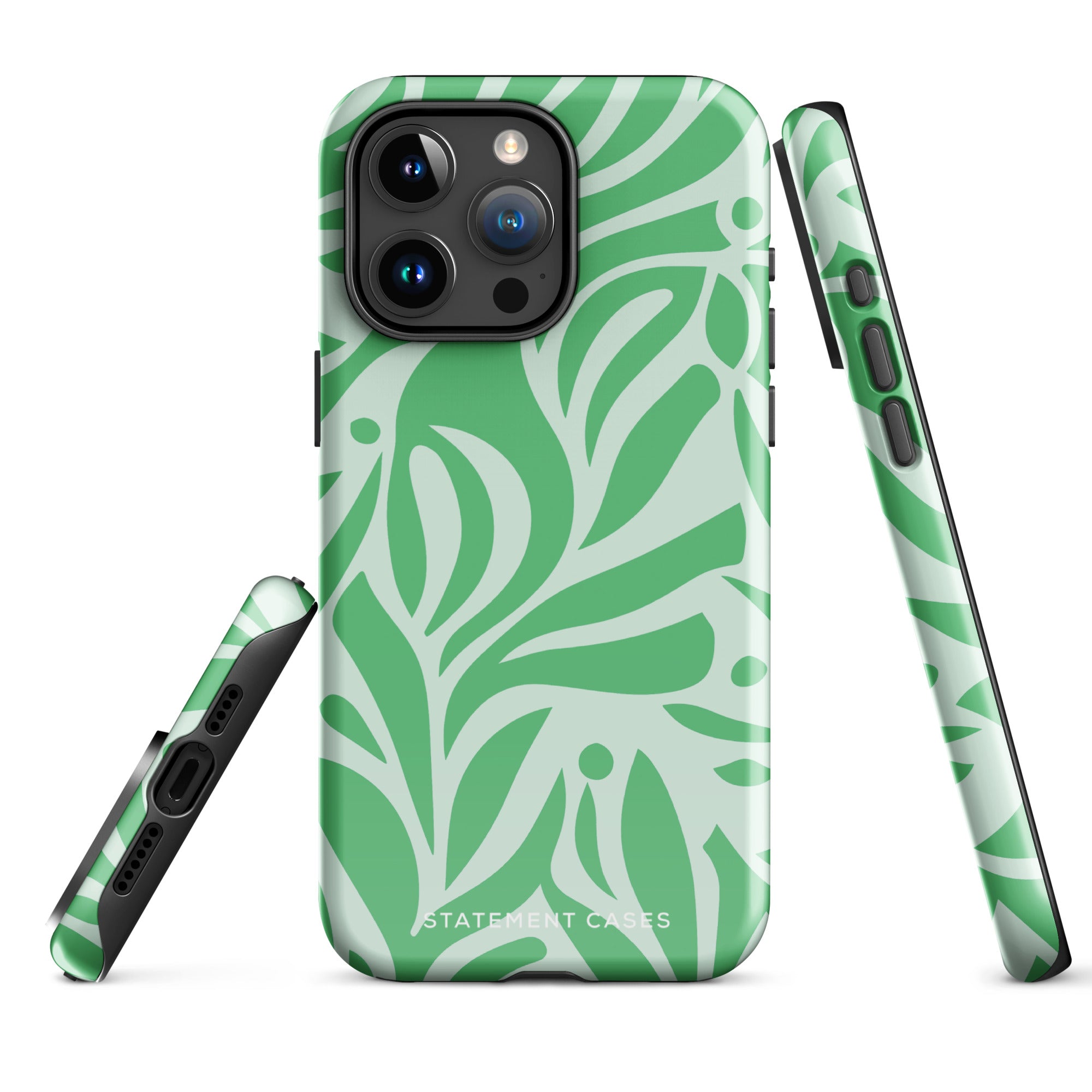 The Selva Verde for iPhone by Statement Cases is shown from the back, featuring a green and light green leaf-patterned protective case. The case highlights the smartphone's camera module with multiple lenses. Designed with impact-resistant polycarbonate, it has a smooth finish and "Statement Cases" printed near the bottom.