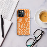 A Savannah Ardiente for iPhone from Statement Cases, featuring a dual-layered phone case in orange with a floral pattern showcasing cream-colored flowers, leaves, and geometric shapes. This impact-resistant polycarbonate case displays "STATEMENT CASES" at the bottom and reveals the camera lenses at the top left corner.