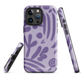 The Luna Morada for iPhone by Statement Cases is a durable phone case with a purple protective exterior featuring abstract dark purple and lavender patterns. The design includes geometric shapes and curves, giving it a modern artistic look. Made from impact-resistant polycarbonate, the lower part of the case prominently displays "STATEMENT CASES.