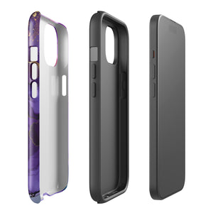 A Statement Cases Golden Orchid Marble for iPhone with a case featuring an abstract design of swirling purple, pink, and gold hues over a white background. The marbled patterns with metallic accents provide dual-layer protection and are impact-resistant. The top of the case has cutouts for the phone's camera lenses and is induction charging compatible.