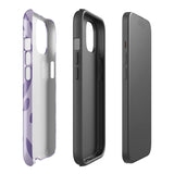 The Luna Morada for iPhone by Statement Cases is a durable phone case with a purple protective exterior featuring abstract dark purple and lavender patterns. The design includes geometric shapes and curves, giving it a modern artistic look. Made from impact-resistant polycarbonate, the lower part of the case prominently displays "STATEMENT CASES.