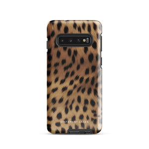 A smartphone with a leopard print, dual-layer design phone case featuring four camera lenses on the back is displayed against a white background. The bottom of the tough phone case has the brand name "Statement Cases" in white letters. The product name is "Daring Cheetah Fur for Samsung".