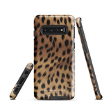 A smartphone with a leopard print, dual-layer design phone case featuring four camera lenses on the back is displayed against a white background. The bottom of the tough phone case has the brand name "Statement Cases" in white letters. The product name is "Daring Cheetah Fur for Samsung".