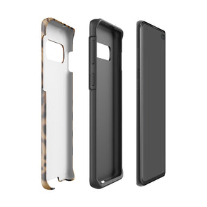 A smartphone with a leopard print, dual-layer design phone case featuring four camera lenses on the back is displayed against a white background. The bottom of the tough phone case has the brand name "Statement Cases" in white letters. The product name is "Daring Cheetah Fur for Samsung".