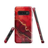 A red and black Scarlet Marble for Samsung with a marble-like pattern and gold accents, designed for a phone with multiple rear cameras. This tough phone case features an impact-resistant, dual-layer design and showcases the brand name "Statement Cases" near the bottom.