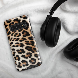 A tough phone case with a leopard print design is displayed. The dual-layer design features black and brown spots on a tan background, mimicking leopard fur. The text "Statement Cases" is printed on the lower part of the impact-resistant case. This is the Mighty Jaguar Fur for Samsung by Statement Cases.