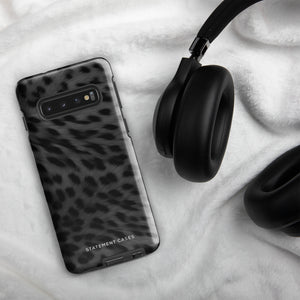 A Nocturnal Hunter Fur for Samsung with a black and gray leopard print phone case featuring a dual-layer design. The camera module has five lenses and a flash. The text "STATEMENT CASES" is written at the bottom of this impact-resistant case.