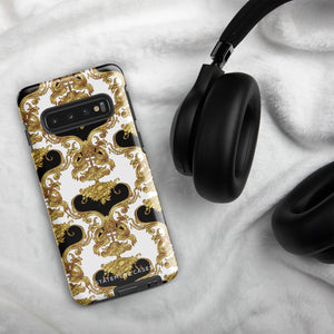 A phone case with an ornate Baroque-style design, featuring an intricate pattern of gold and black swirls and vines on a white background. This dual-layer design is not only impact-resistant but also stylish. The camera cutout is large and accommodates multiple lenses, with "Rebellious Spirit for Samsung" displayed at the bottom.