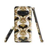A phone case with an ornate Baroque-style design, featuring an intricate pattern of gold and black swirls and vines on a white background. This dual-layer design is not only impact-resistant but also stylish. The camera cutout is large and accommodates multiple lenses, with "Rebellious Spirit for Samsung" displayed at the bottom.