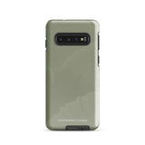 A Pistachio Haze for Samsung with a green phone case featuring a subtle floral pattern. This tough phone case has cutouts for three cameras and a flash, with the brand name "Statement Cases" printed at the bottom. The side buttons are visible, and there's a port at the bottom for easy access.