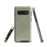 A Pistachio Haze for Samsung with a green phone case featuring a subtle floral pattern. This tough phone case has cutouts for three cameras and a flash, with the brand name "Statement Cases" printed at the bottom. The side buttons are visible, and there's a port at the bottom for easy access.
