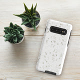 A Terrazzo Chic for Samsung with a rectangular off-white and gray terrazzo patterned case. The durable phone case by Statement Cases features three prominent buttons on the side and five camera lens openings on the back. The words "Statement Cases" are faintly visible at the bottom, highlighting its dual-layer protection.