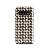 A Statement Cases Timeless Houndstooth for Samsung featuring a black and beige houndstooth pattern. The camera cutout at the top rear is designed for a triple-lens camera. With its dual-layer design and slim profile, this impact-resistant case also boasts a glossy finish.