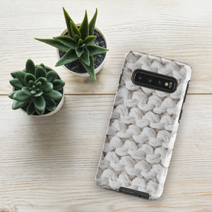 A Chunky Comfort for Samsung with a realistic knitted texture featuring white interwoven yarns. The impact-resistant case has multiple camera cutouts and a shock-absorbing dual-layer design. The brand name "Statement Cases" is printed at the bottom.