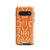 This stylish smartphone accessory, the Savannah Ardiente for Samsung by Statement Cases, features a shock-absorbing, colorful patterned case adorned with abstract flower designs in beige on an orange background. This impact-resistant phone case wraps around the back of your device, providing robust protection for its multiple camera lenses in the corner.