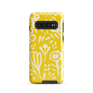 The Sol Dorado for Samsung by Statement Cases is a durable phone case featuring a bright yellow background adorned with an abstract white floral pattern, showcasing various flowers and leaves. Near the bottom edge, the text "STATEMENT CASE" highlights its dual-layer design for enhanced durability.