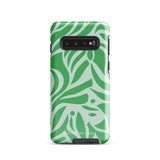 The Selva Verde for Samsung, a product by Statement Cases, is a durable, dual-layer phone case adorned with a green and white leafy design. The back of the case includes a camera cutout, and the bottom is printed with "Statement Cases.