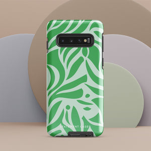 The Selva Verde for Samsung, a product by Statement Cases, is a durable, dual-layer phone case adorned with a green and white leafy design. The back of the case includes a camera cutout, and the bottom is printed with "Statement Cases.