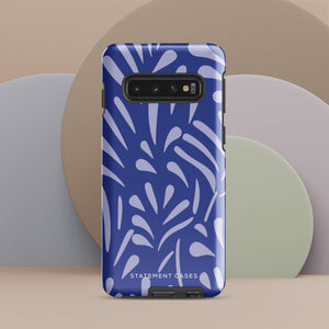 The Mariposa Azul for Samsung smartphone case from Statement Cases is adorned with an impact-resistant design featuring light purple abstract shapes on a blue background. This dual-layer case proudly displays the text "STATEMENT CASES" at the bottom, ensuring that the camera lenses and buttons of your phone remain clearly visible.