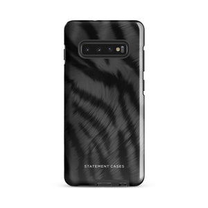 A tough smartphone with a black, textured case that has a silky, animal fur pattern. The dual-layer phone case has cutouts for the camera and side buttons, and the words "Statement Cases" are printed near the bottom.