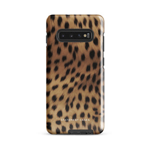 A smartphone with a leopard print, dual-layer design phone case featuring four camera lenses on the back is displayed against a white background. The bottom of the tough phone case has the brand name "Statement Cases" in white letters. The product name is "Daring Cheetah Fur for Samsung".