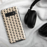 A beige smartphone case with a repeating black double-C logo pattern. The back of the impact-resistant phone case features camera cutouts aligned on the left side, accommodating what appears to be a multi-lens camera system. This is the Heritage Monogram for Samsung by Statement Cases.