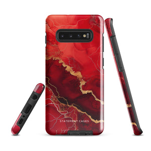 A red and black Scarlet Marble for Samsung with a marble-like pattern and gold accents, designed for a phone with multiple rear cameras. This tough phone case features an impact-resistant, dual-layer design and showcases the brand name "Statement Cases" near the bottom.