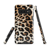 A tough phone case with a leopard print design is displayed. The dual-layer design features black and brown spots on a tan background, mimicking leopard fur. The text "Statement Cases" is printed on the lower part of the impact-resistant case. This is the Mighty Jaguar Fur for Samsung by Statement Cases.