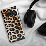 A tough phone case with a leopard print design is displayed. The dual-layer design features black and brown spots on a tan background, mimicking leopard fur. The text "Statement Cases" is printed on the lower part of the impact-resistant case. This is the Mighty Jaguar Fur for Samsung by Statement Cases.