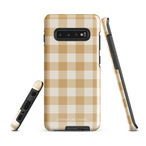 A beige and white checkered phone case is shown. Designed to fit a smartphone with a horizontal dual-camera setup, it features "STATEMENT CASES" printed at the bottom. This impact-resistant phone case offers both style and protection.Product Name: Gingham Grace for Samsung Brand Name: Statement Cases