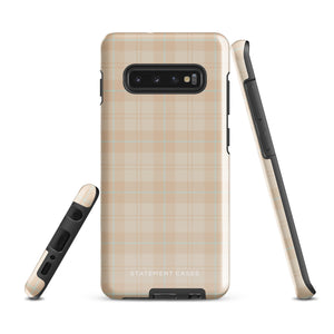 A smartphone with an impact-resistant beige plaid phone case featuring subtle light blue accents. The camera, flash, and sensor modules are visible at the top. The bottom part of the case has the text "Sophisticated Plaid for Samsung" printed on it by Statement Cases.