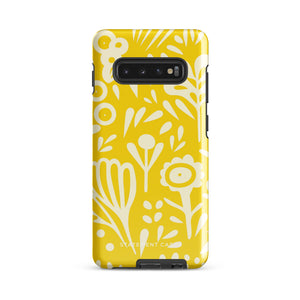 The Sol Dorado for Samsung by Statement Cases is a durable phone case featuring a bright yellow background adorned with an abstract white floral pattern, showcasing various flowers and leaves. Near the bottom edge, the text "STATEMENT CASE" highlights its dual-layer design for enhanced durability.