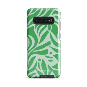 The Selva Verde for Samsung, a product by Statement Cases, is a durable, dual-layer phone case adorned with a green and white leafy design. The back of the case includes a camera cutout, and the bottom is printed with "Statement Cases.