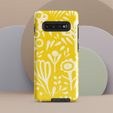 The Sol Dorado for Samsung by Statement Cases is a durable phone case featuring a bright yellow background adorned with an abstract white floral pattern, showcasing various flowers and leaves. Near the bottom edge, the text "STATEMENT CASE" highlights its dual-layer design for enhanced durability.