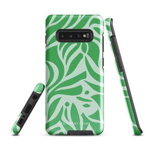 The Selva Verde for Samsung, a product by Statement Cases, is a durable, dual-layer phone case adorned with a green and white leafy design. The back of the case includes a camera cutout, and the bottom is printed with "Statement Cases.