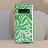 The Selva Verde for Samsung, a product by Statement Cases, is a durable, dual-layer phone case adorned with a green and white leafy design. The back of the case includes a camera cutout, and the bottom is printed with "Statement Cases.