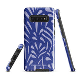 The Mariposa Azul for Samsung smartphone case from Statement Cases is adorned with an impact-resistant design featuring light purple abstract shapes on a blue background. This dual-layer case proudly displays the text "STATEMENT CASES" at the bottom, ensuring that the camera lenses and buttons of your phone remain clearly visible.