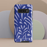 The Mariposa Azul for Samsung smartphone case from Statement Cases is adorned with an impact-resistant design featuring light purple abstract shapes on a blue background. This dual-layer case proudly displays the text "STATEMENT CASES" at the bottom, ensuring that the camera lenses and buttons of your phone remain clearly visible.