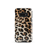 A tough phone case with a leopard print design is displayed. The dual-layer design features black and brown spots on a tan background, mimicking leopard fur. The text "Statement Cases" is printed on the lower part of the impact-resistant case. This is the Mighty Jaguar Fur for Samsung by Statement Cases.