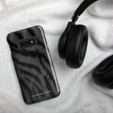 A tough smartphone with a black, textured case that has a silky, animal fur pattern. The dual-layer phone case has cutouts for the camera and side buttons, and the words "Statement Cases" are printed near the bottom.