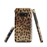 A smartphone with a leopard print, dual-layer design phone case featuring four camera lenses on the back is displayed against a white background. The bottom of the tough phone case has the brand name "Statement Cases" in white letters. The product name is "Daring Cheetah Fur for Samsung".