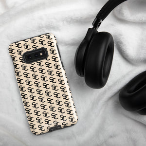 A beige smartphone case with a repeating black double-C logo pattern. The back of the impact-resistant phone case features camera cutouts aligned on the left side, accommodating what appears to be a multi-lens camera system. This is the Heritage Monogram for Samsung by Statement Cases.